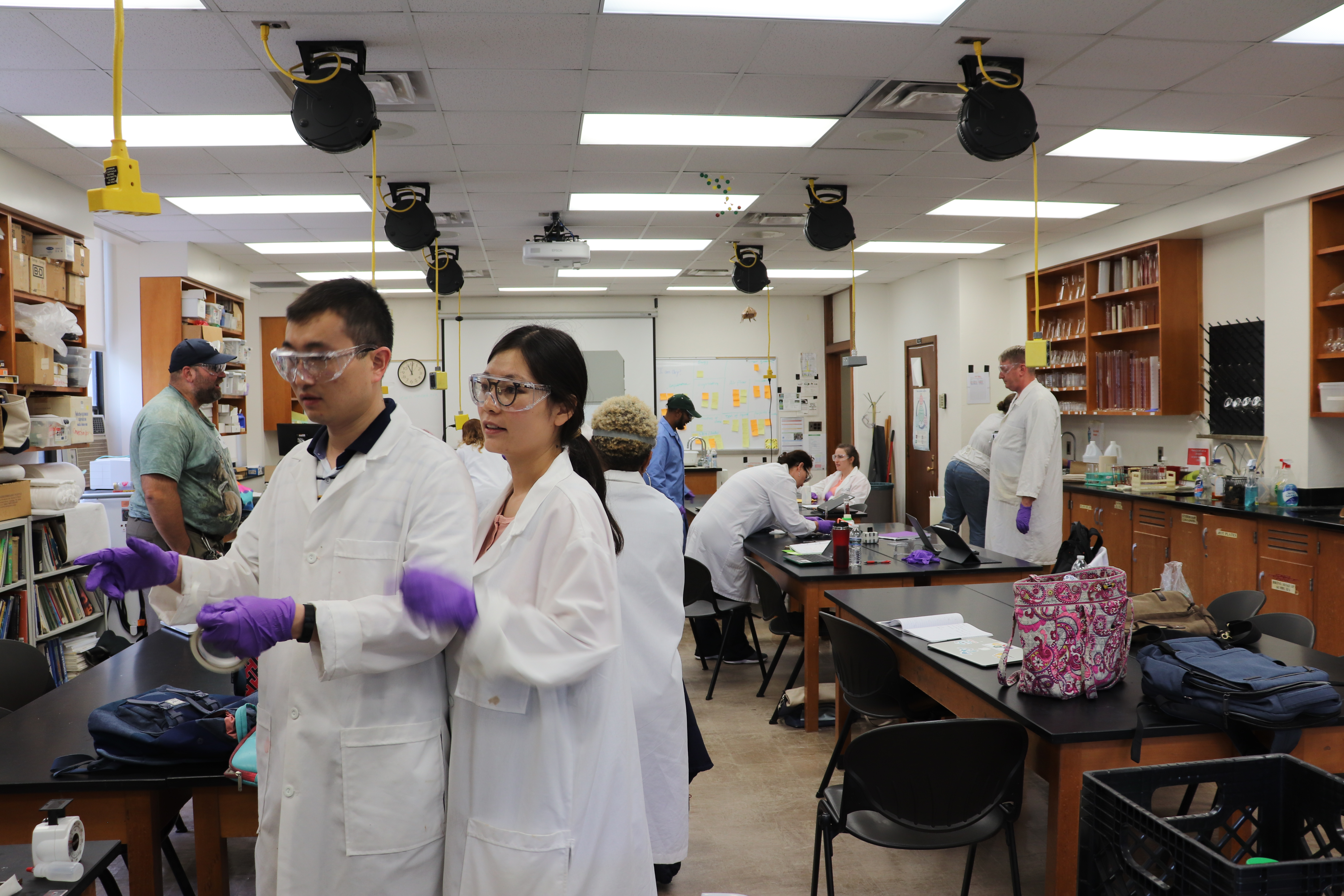 Peng He and Tingting Li in lab on campus